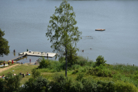 View over the lake, the bathing campers and the raft, as seen from the play ground for the small children